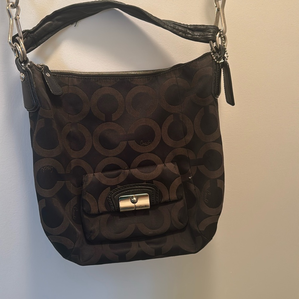 Used Coach purse. Medium black with long and short straps. Good condition